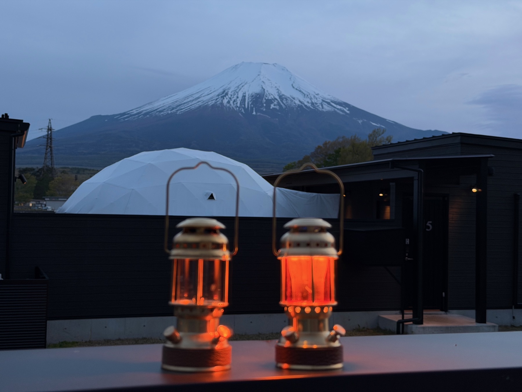 SAKAKI Gear lanterns glowing at dusk with Mt. Fuji, taken at VISION GLAMPING, Japan