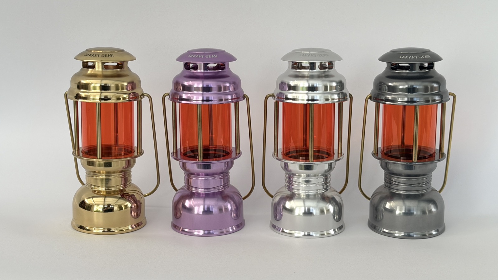 All four finishes of the Namonaki Lantern Akatsuki: brass, wisteria, silver and gunmetal